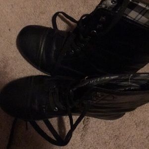 A pair of black combat boots